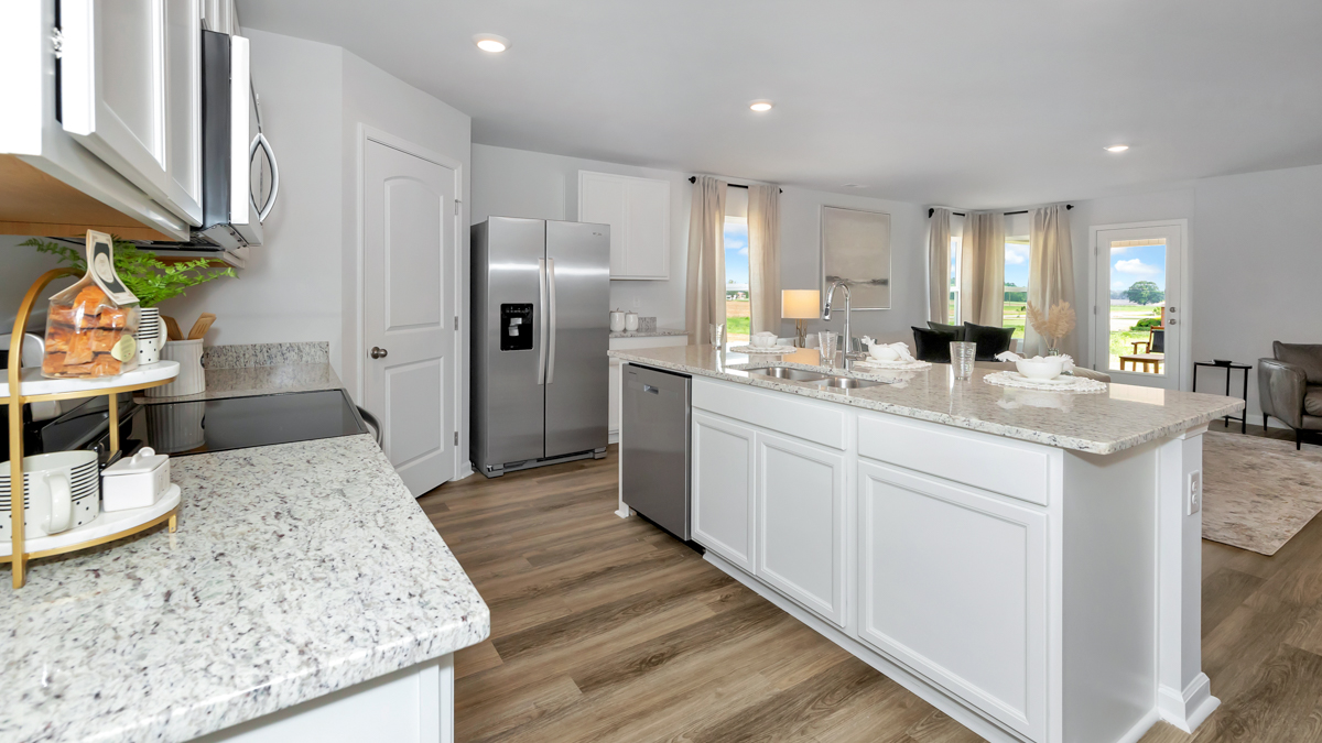 Kitchen island with view of dining / living room area