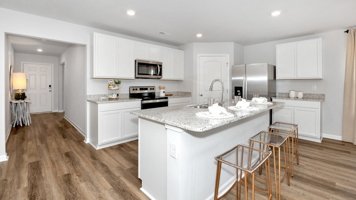 kitchen island with view of the foyer