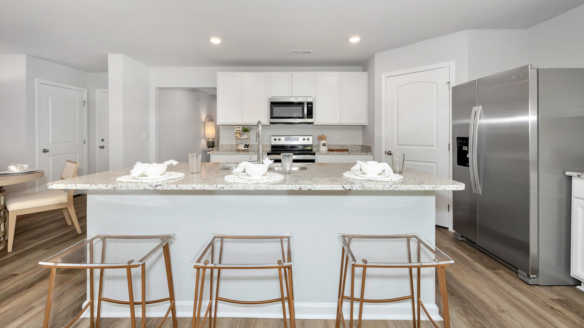 Kitchen sink with granite surround and stainless steel appliances