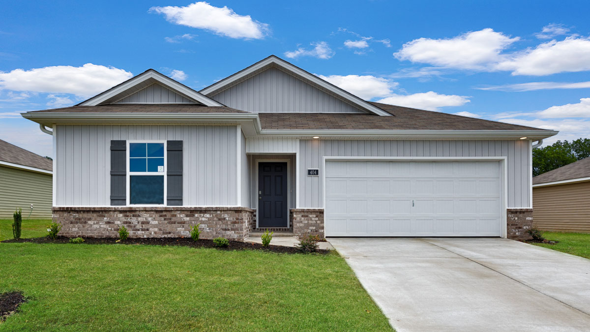 Single story home with vinyl and brick and two car garage