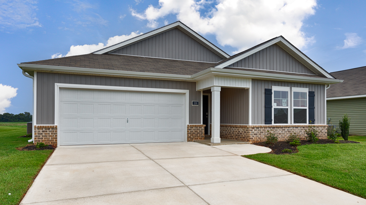 Single story home with vinyl and brick and two car garage