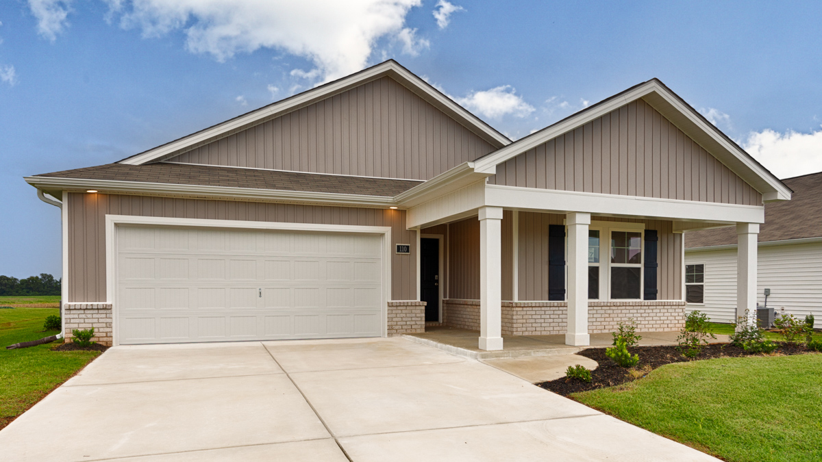 Single story home with vinyl and brick and two car garage