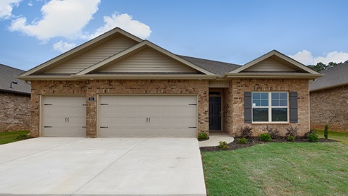 Single story home with brick and three car garage