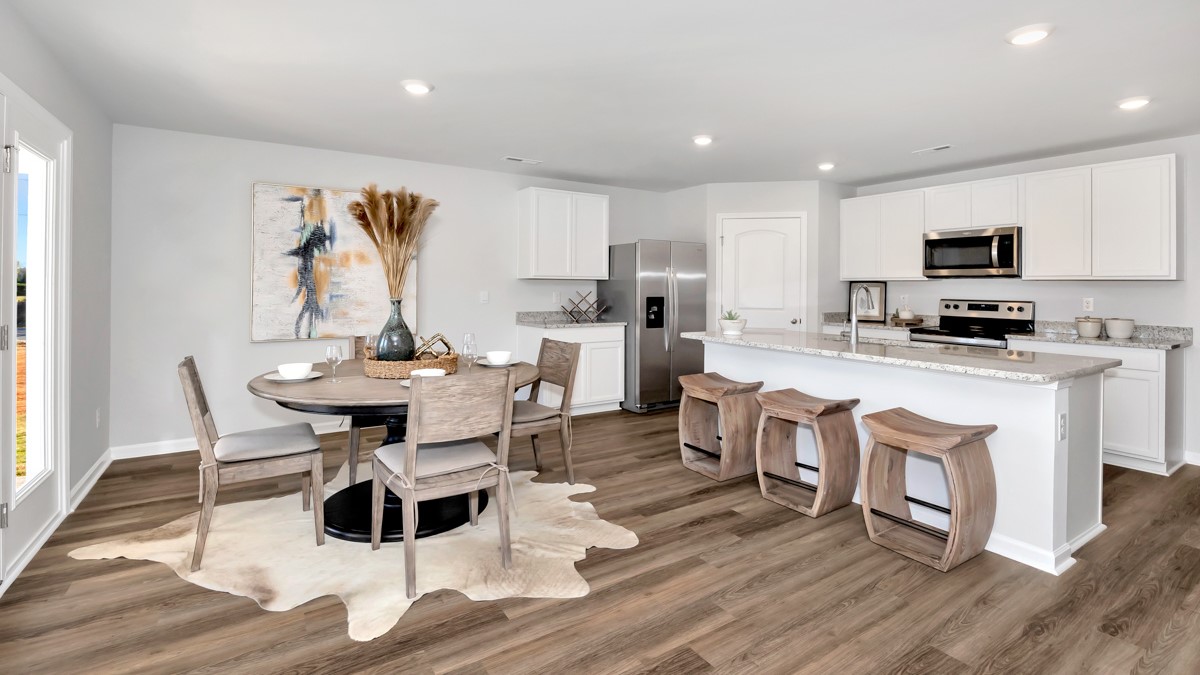 Kitchen island with view of dining / living room area