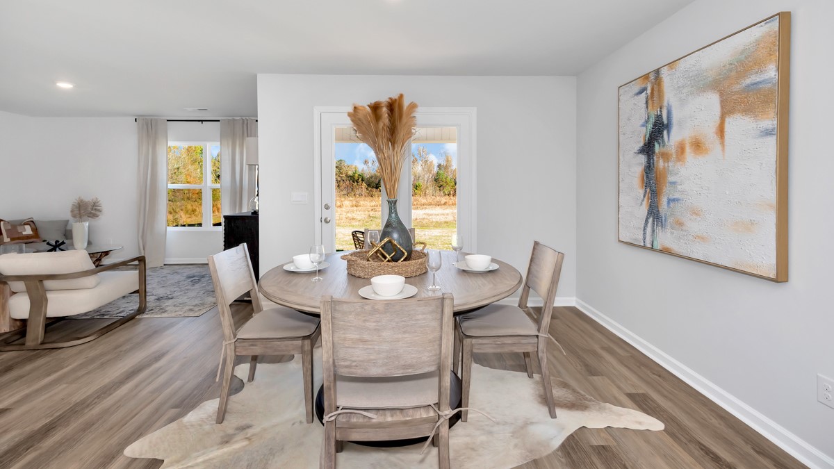 Dining room area with LVP flooring and windows