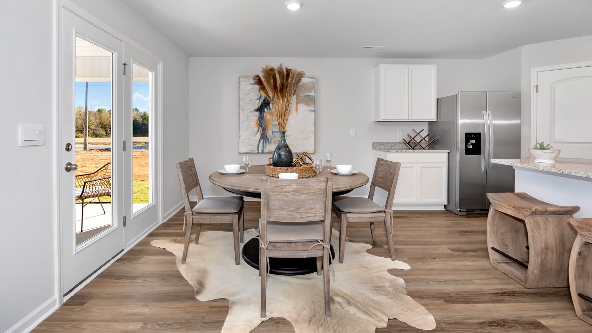 Dining room area with LVP flooring and windows
