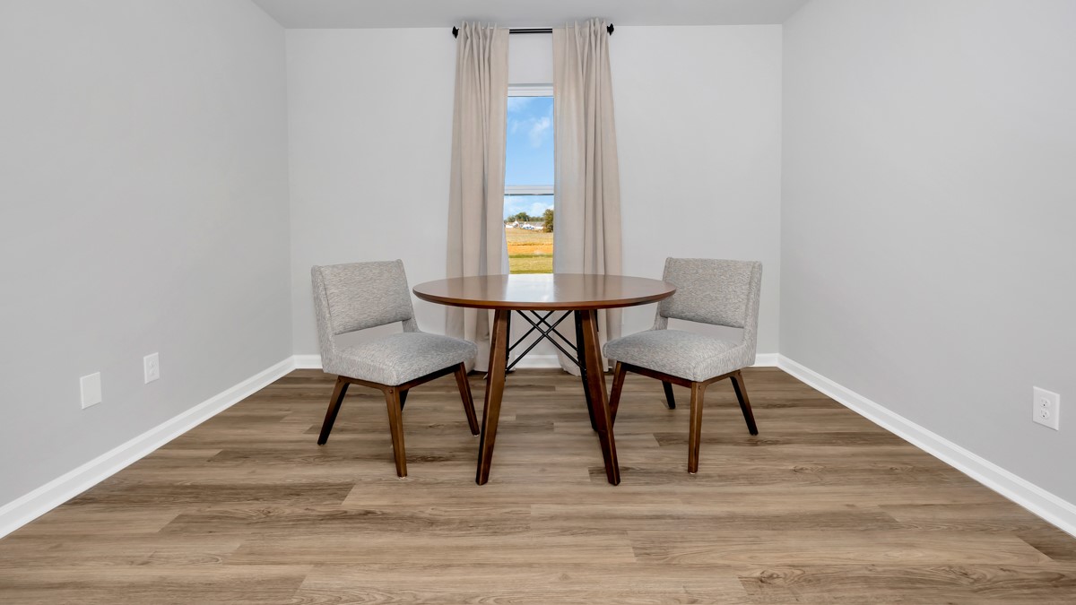 Dining room area with LVP flooring and windows