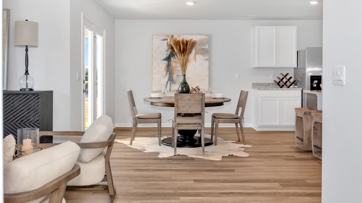 Dining room area with LVP flooring and windows