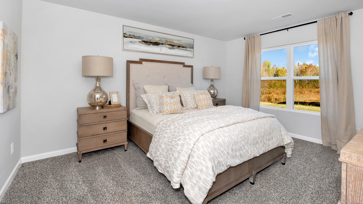 Primary bedroom with carpet