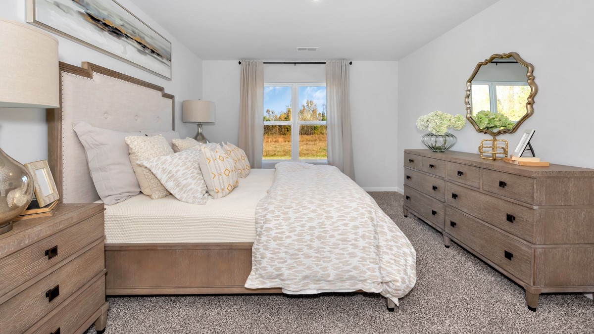 Primary bedroom with carpet