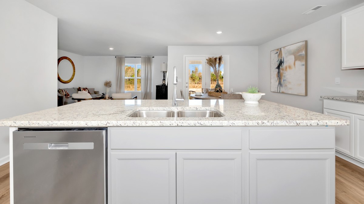 Kitchen island with view of dining / living room area