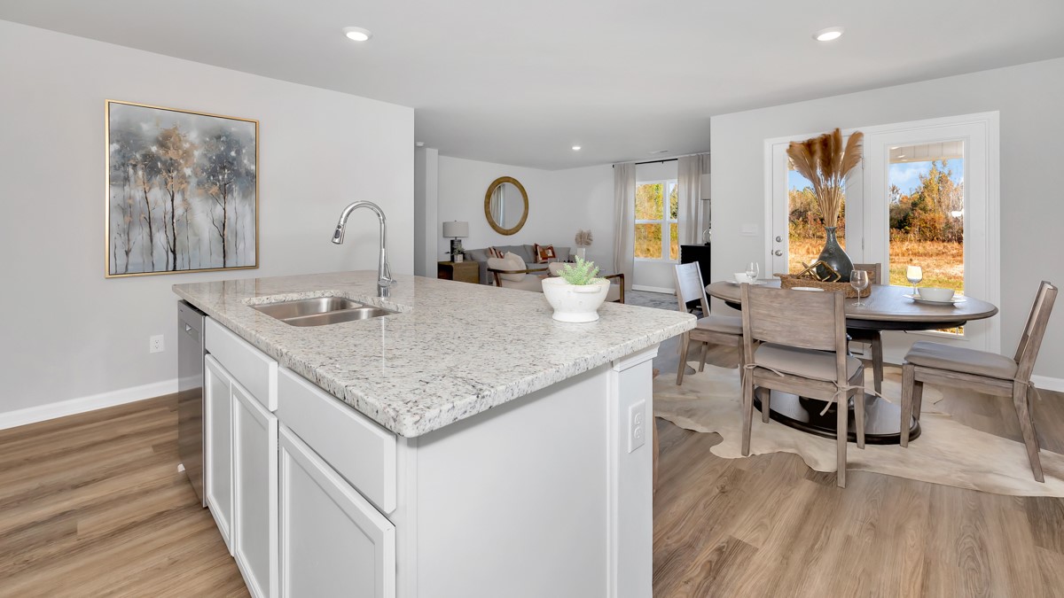 Kitchen island with view of dining / living room area