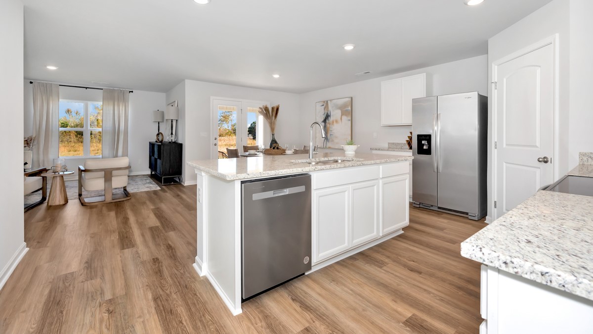 Kitchen island with view of dining / living room area