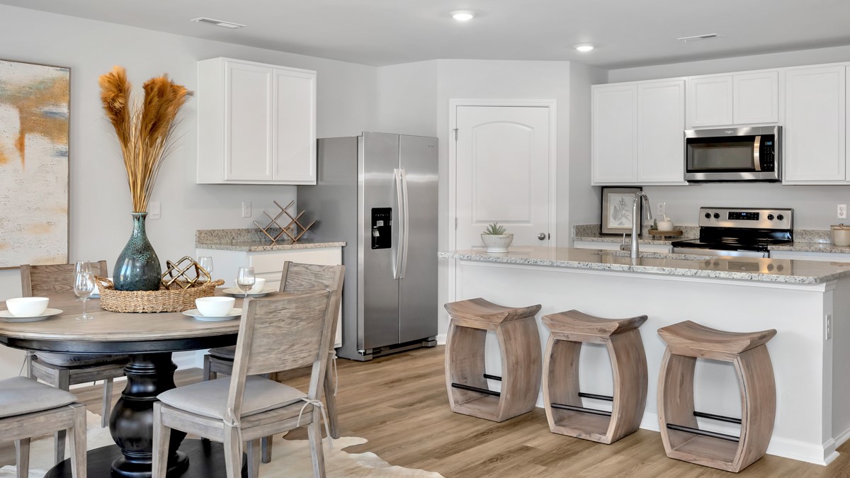 Kitchen island with view of dining / living room area