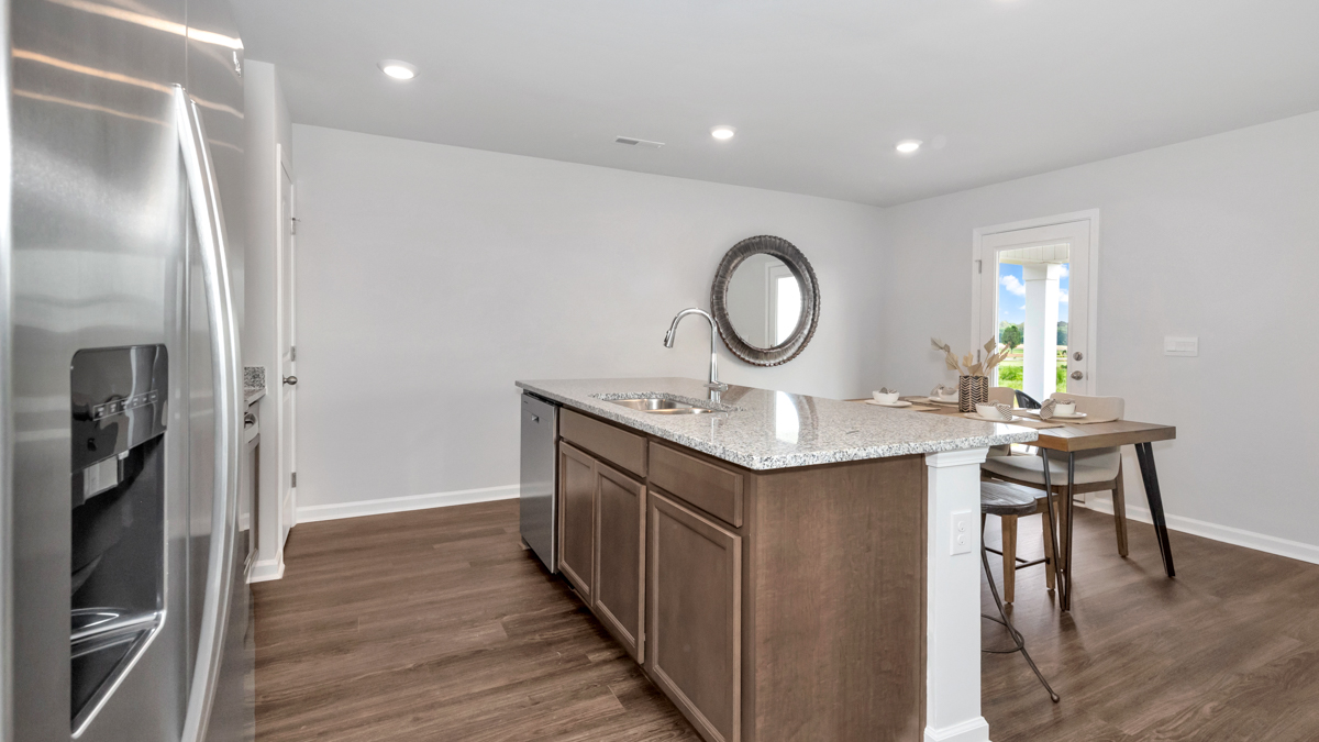 Kitchen island with view of dining / living room area
