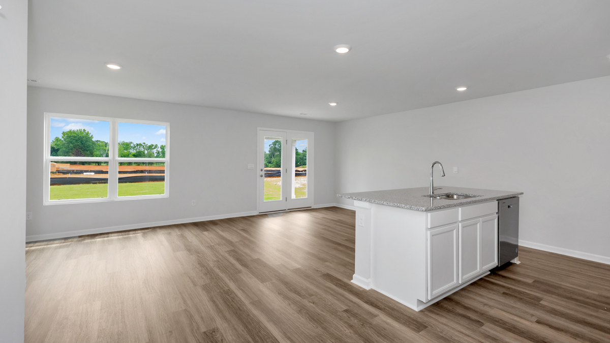 Kitchen island with view of dining / living room area