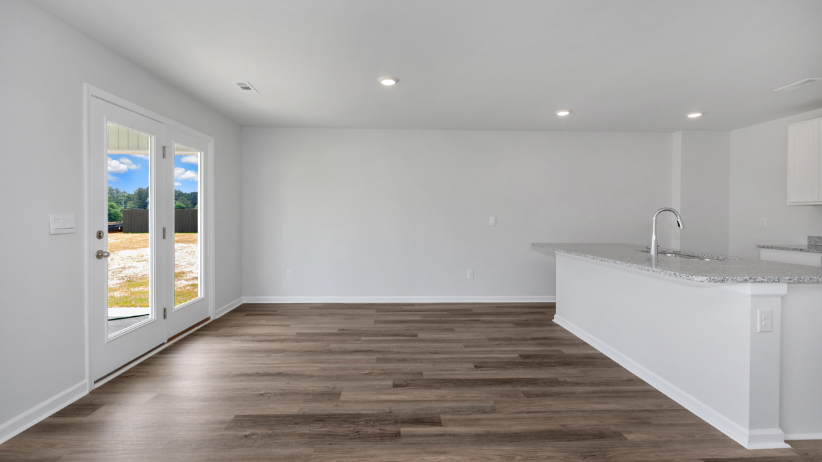 Kitchen island with view of dining / living room area
