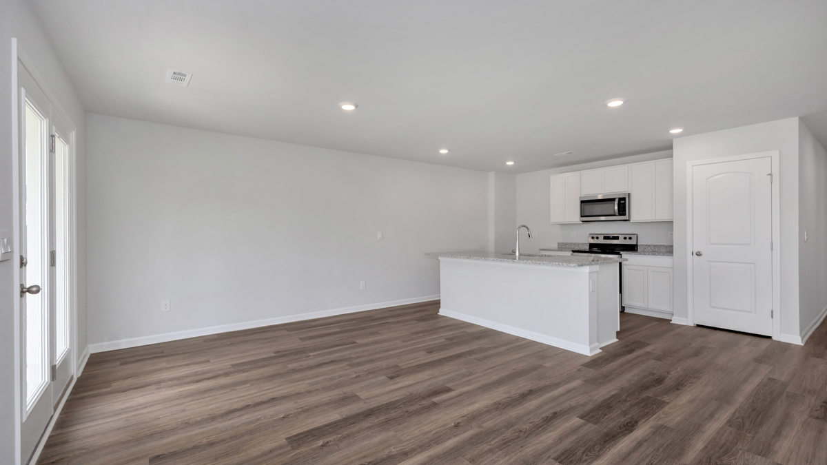 Kitchen island with view of dining / living room area