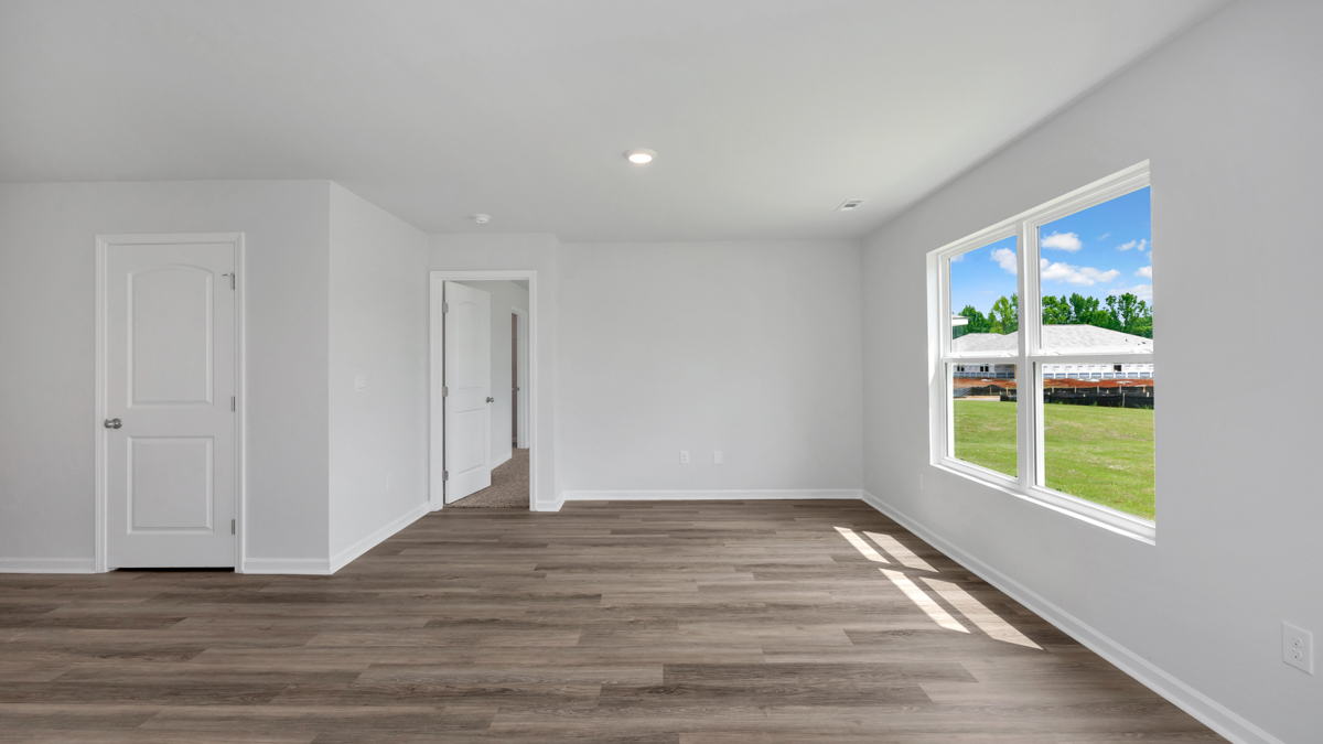 Dining room area with LVP flooring and windows