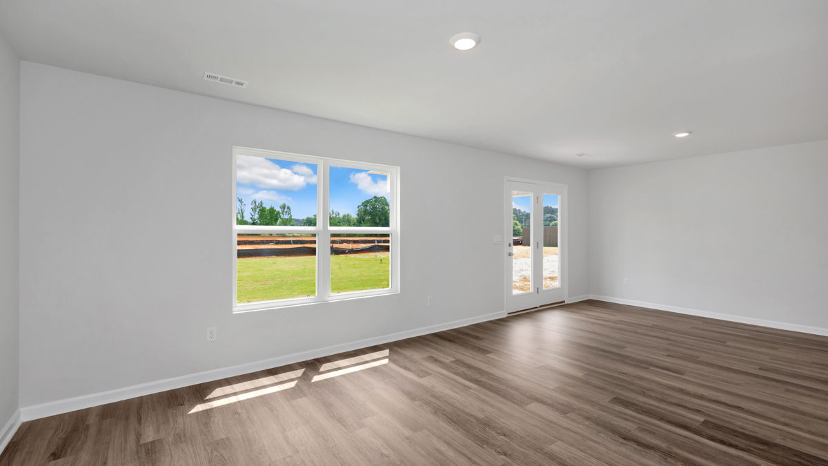 Dining room area with LVP flooring and windows