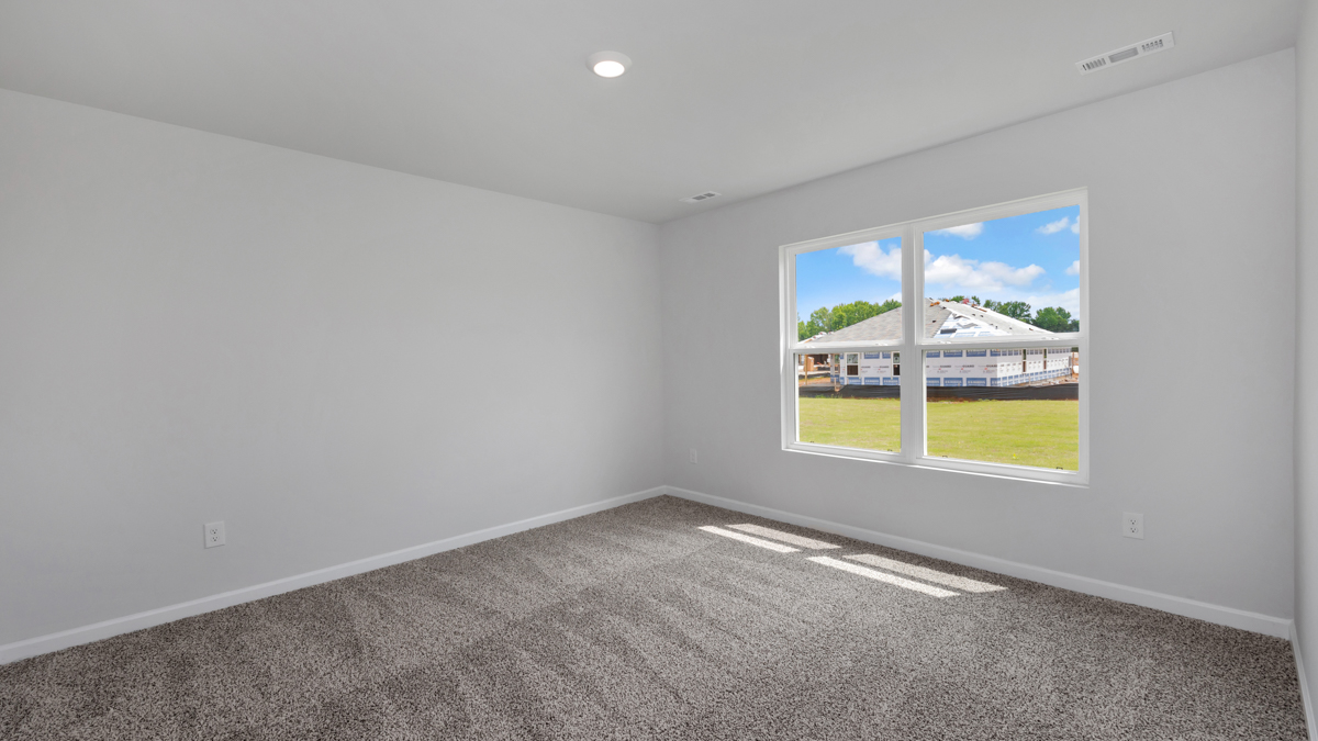 Primary bedroom with carpet