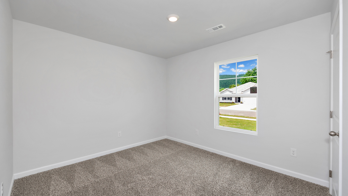 Primary bedroom with carpet