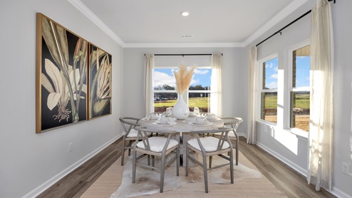 Dining room area with LVP flooring and windows