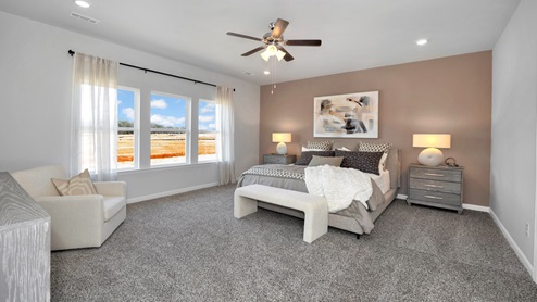 Primary bedroom with carpet
