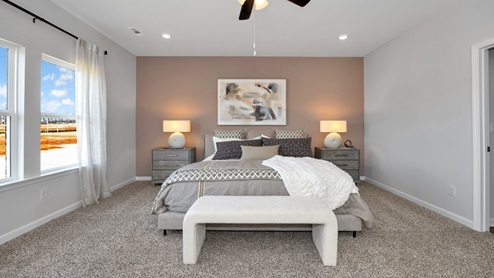 Primary bedroom with carpet