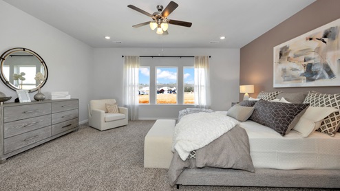 Primary bedroom with carpet