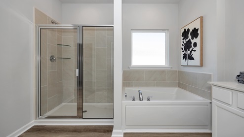 Primary bath with walk in shower and sitting tub