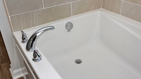 Primary bath with walk in shower and sitting tub