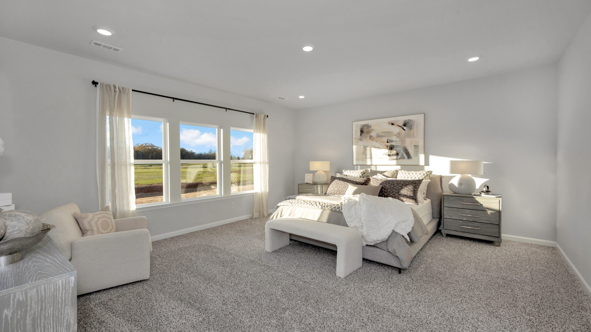 Primary bedroom with carpet