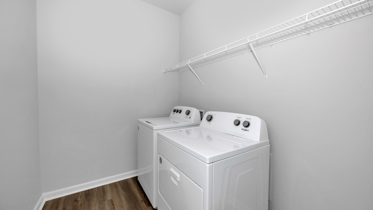 Laundry room with wire shelf and washer dryer hook up