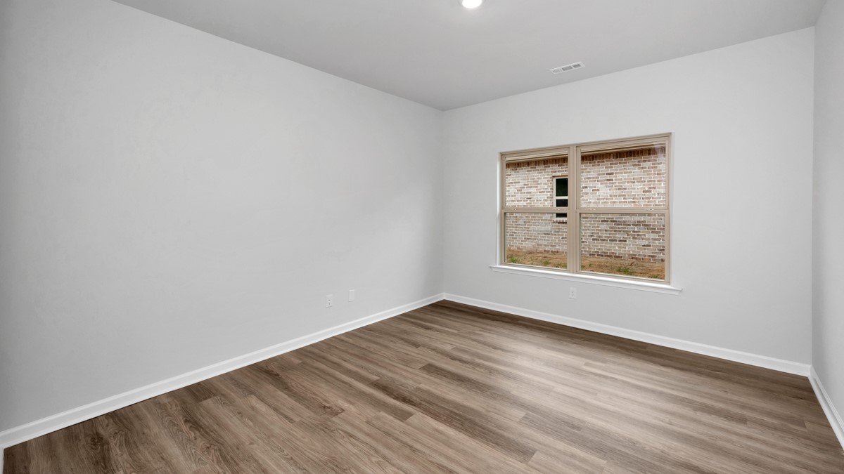 Dining room area with LVP flooring and windows