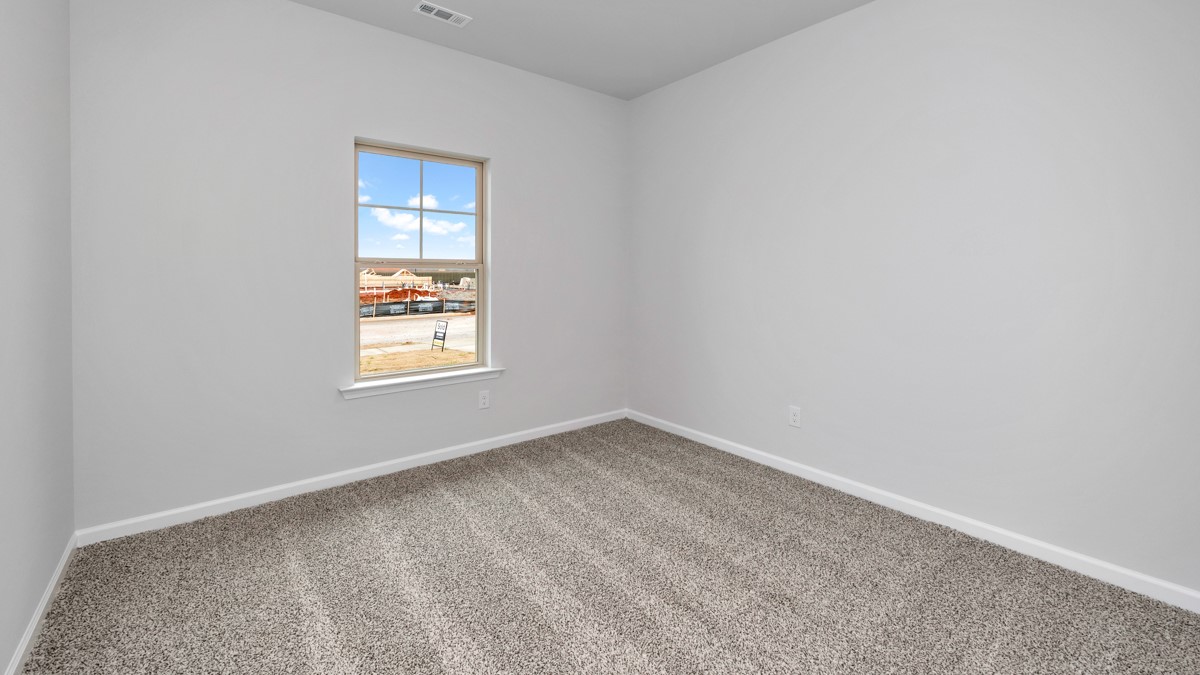 Primary bedroom with carpet