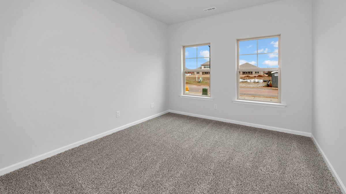 Primary bedroom with carpet