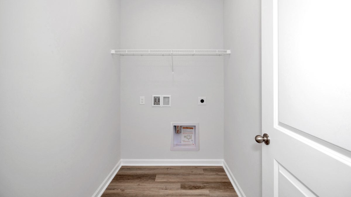 Laundry room with wire shelf and washer dryer hook up