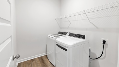 Laundry room with wire shelf and washer dryer hook up