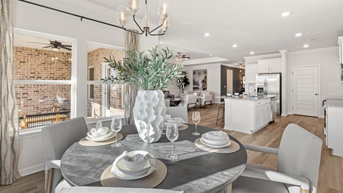 Dining room area with LVP flooring and windows