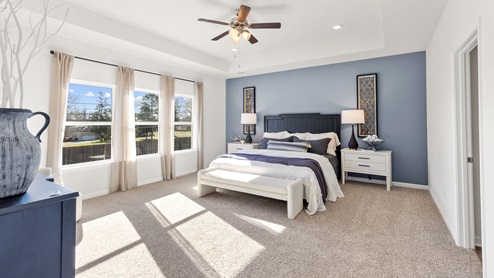 Primary bedroom with carpet