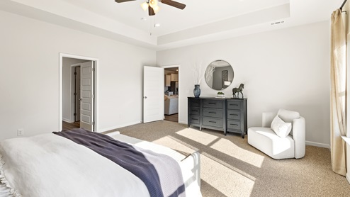 Primary bedroom with carpet