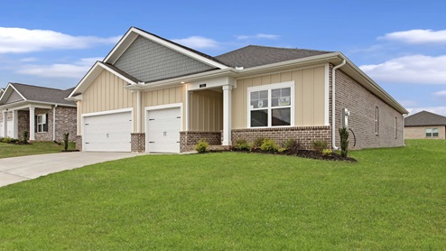 single story brick home with three car garage