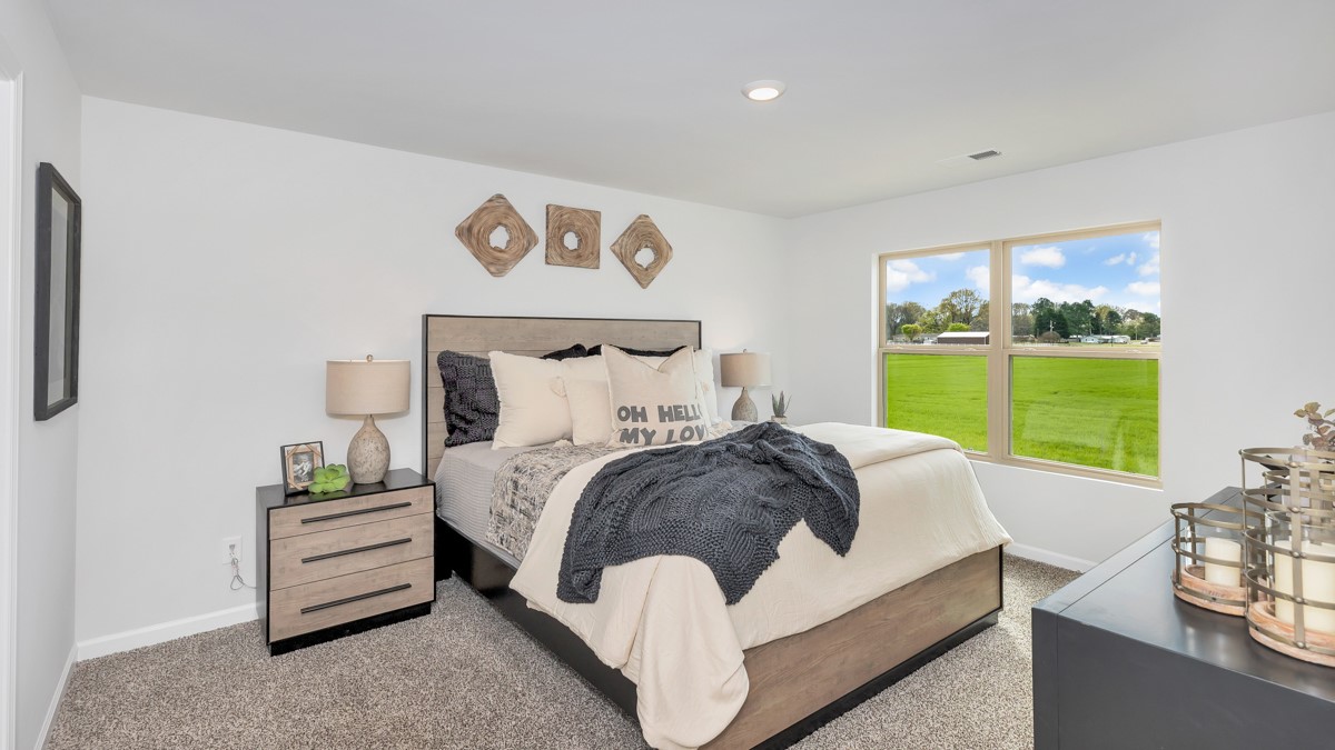 Primary bedroom with carpet