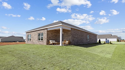Back yard access with view of the back of the house