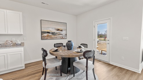 Dining room area with LVP flooring and windows