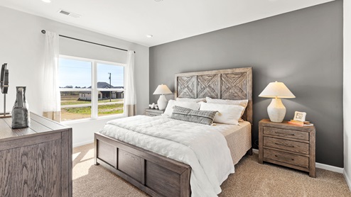 Primary bedroom with carpet