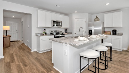 kitchen island with view of the foyer