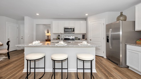 kitchen island with view of the foyer