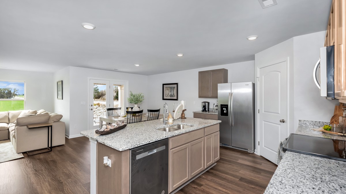 Kitchen island with view of dining / living room area